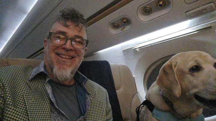 60ish year old man and yellow English lab selfie