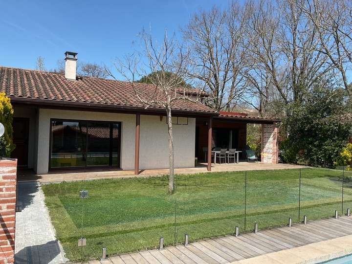 One story house with grass yard